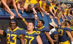 Football players greeting fans