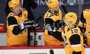 Pittsburgh Penguins' Zach Aston-Reese (12) is greeted by Bryan Rust (17) and Sidney Crosby (87)
