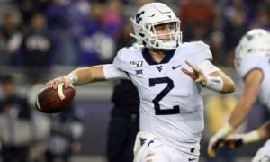 West Virginia quarterback Jarret Doege (2) looks for an open receiver