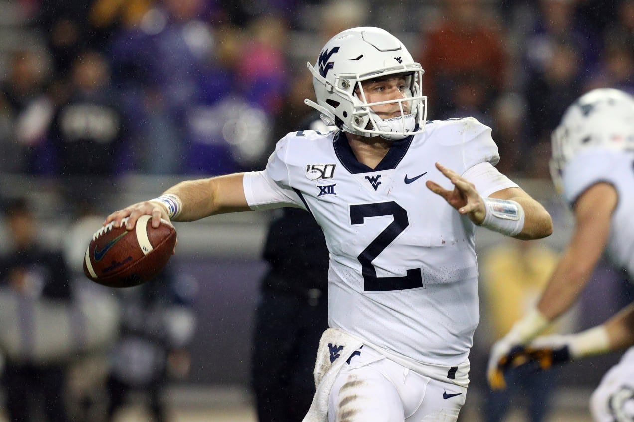 West Virginia quarterback Jarret Doege (2) looks for an open receiver