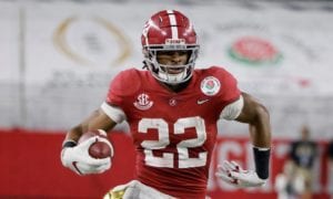 Alabama running back Najee Harris (22) runs with the ball