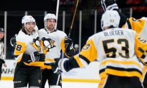 Pittsburgh Penguins' Kris Letang (58) celebrates with teammates