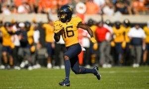 West Virginia wide receiver Winston Wright Jr. (16) runs the ball
