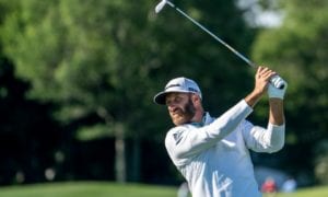Defending champion Dustin Johnson hits from the seventh hole