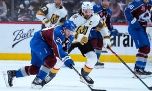 Colorado Avalanche center Nathan MacKinnon (29) moves the puck