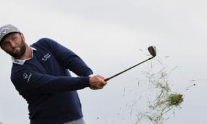 Spain's Jon Rahm plays out of the light rough on the 3rd fairway during a practice round