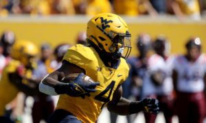 West Virginia's Leddie Brown #4 in action against Virginia Tech