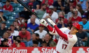 Los Angeles Angels' Shohei Ohtani follows through on a triple