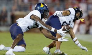 West Virginia cornerback Jackie Matthews (3) catches a pass intended for Oklahoma