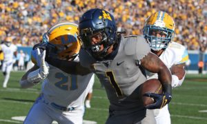 West Virginia wide receiver Winston Wright Jr. (1) is defended by Long Island defensive back