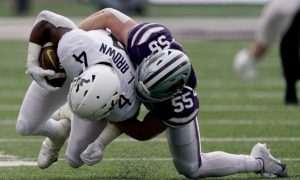 Kansas State linebacker Cody Fletcher (55) tackles West Virginia running back Leddie Brown (4)