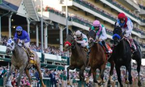 John Velazquez riding Medina Spirit, right, leads Florent Geroux on Mandaloun
