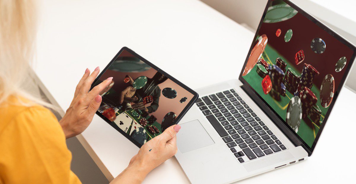 Woman playing online casino games for story on WV online casinos’ March 2024 revenue record.