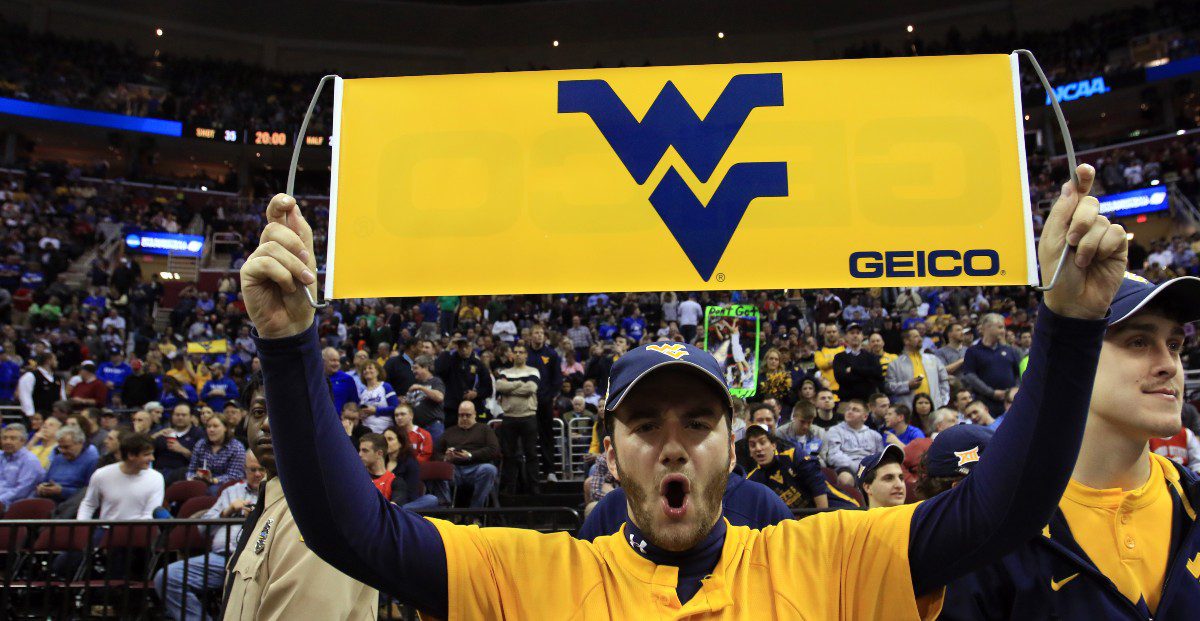 A fan cheers during a West Virginia basketball game.
