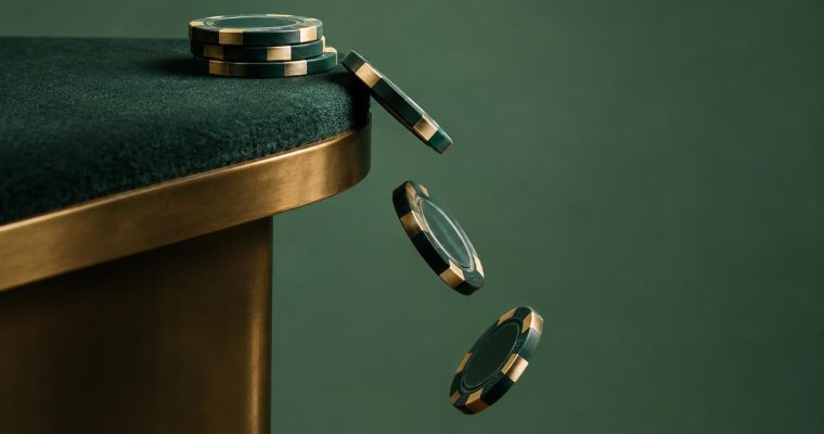A stack of dark green casino chips sits on a green table edge, with three more chips falling off the side.